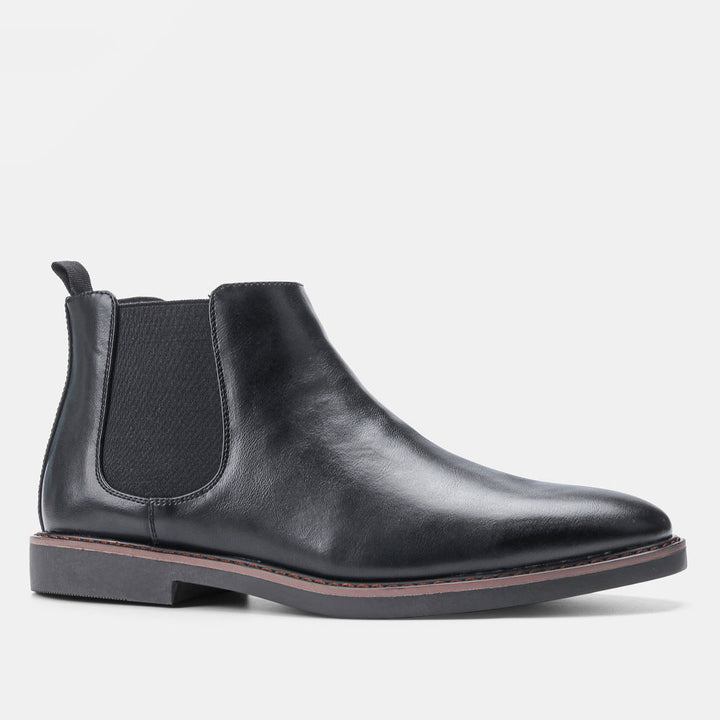 Stivaletti Chelsea uomo eleganti slip-on neri con punta tonda, perfetti per look business e casual invernali.