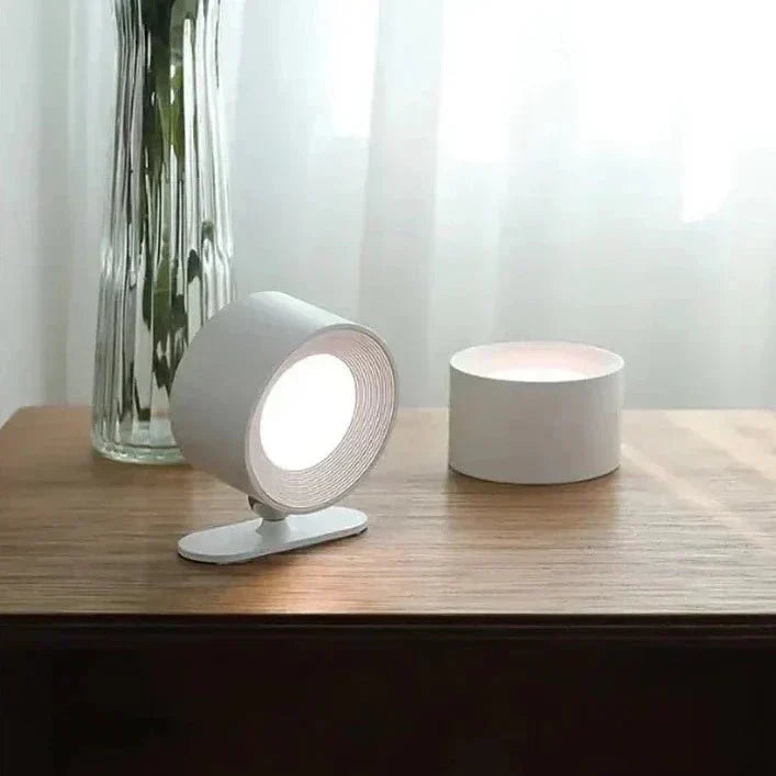 Illuminazione moderna con lampada da parete magnetica LED, wireless, ricaricabile e testa orientabile 360°.