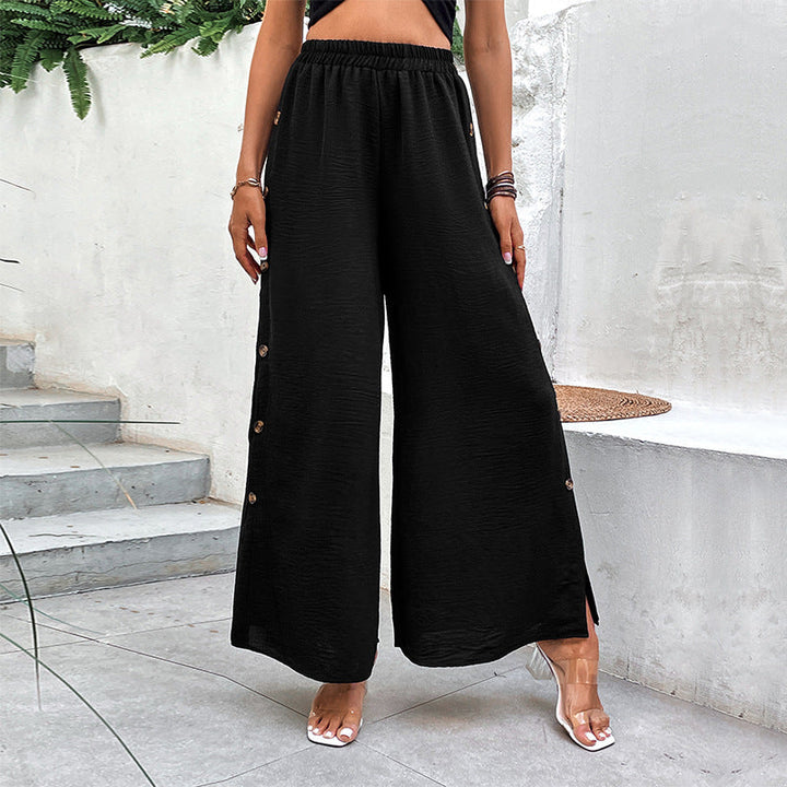 Pantaloni donna comodi a gamba larga, vita alta, con spacchi laterali. Ideali per moda femminile e stile moderno.
