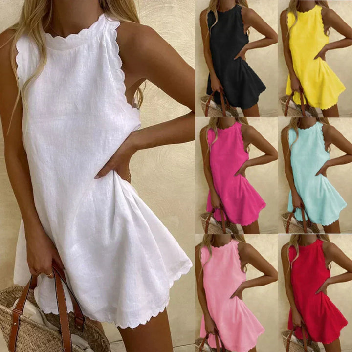 Mini abito donna moda estiva, svasato e senza maniche, con graziosi bordi a conchiglia che valorizzano.