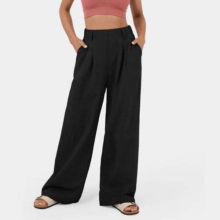 Pantaloni donna vita alta gamba ampia con tasche, perfetti per look eleganti e casual.