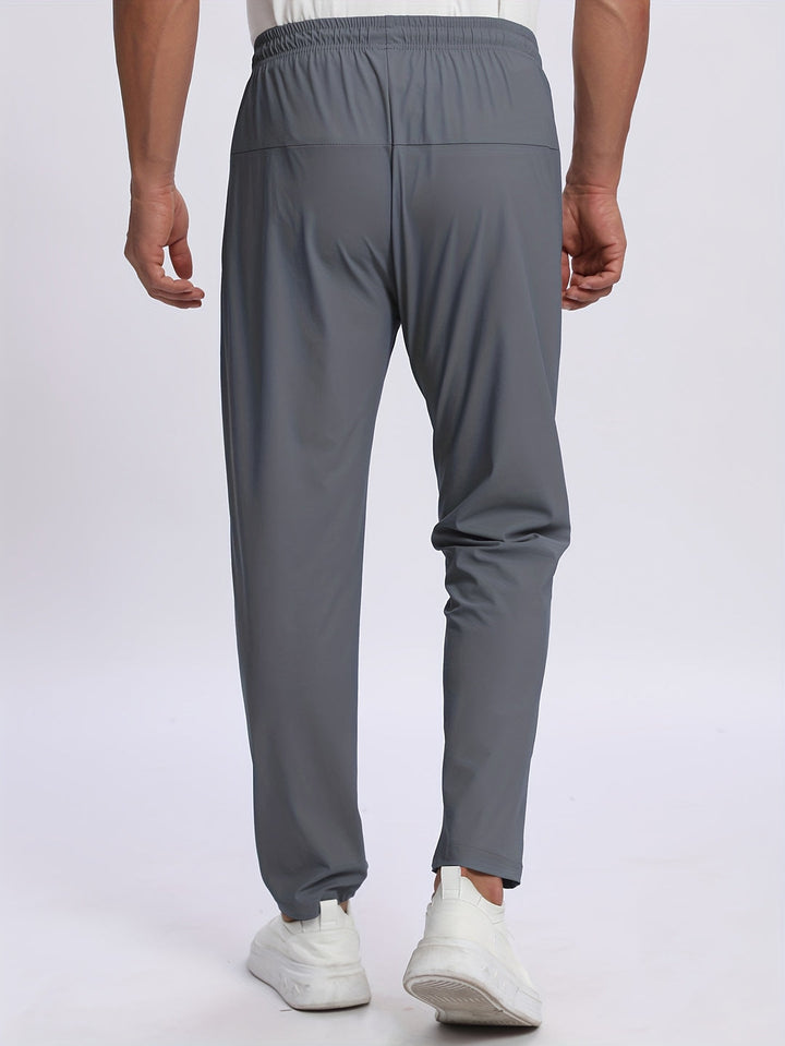 Pantaloni sportivi uomo con tasche zip, comfort e stile per il tuo look quotidiano e casual.