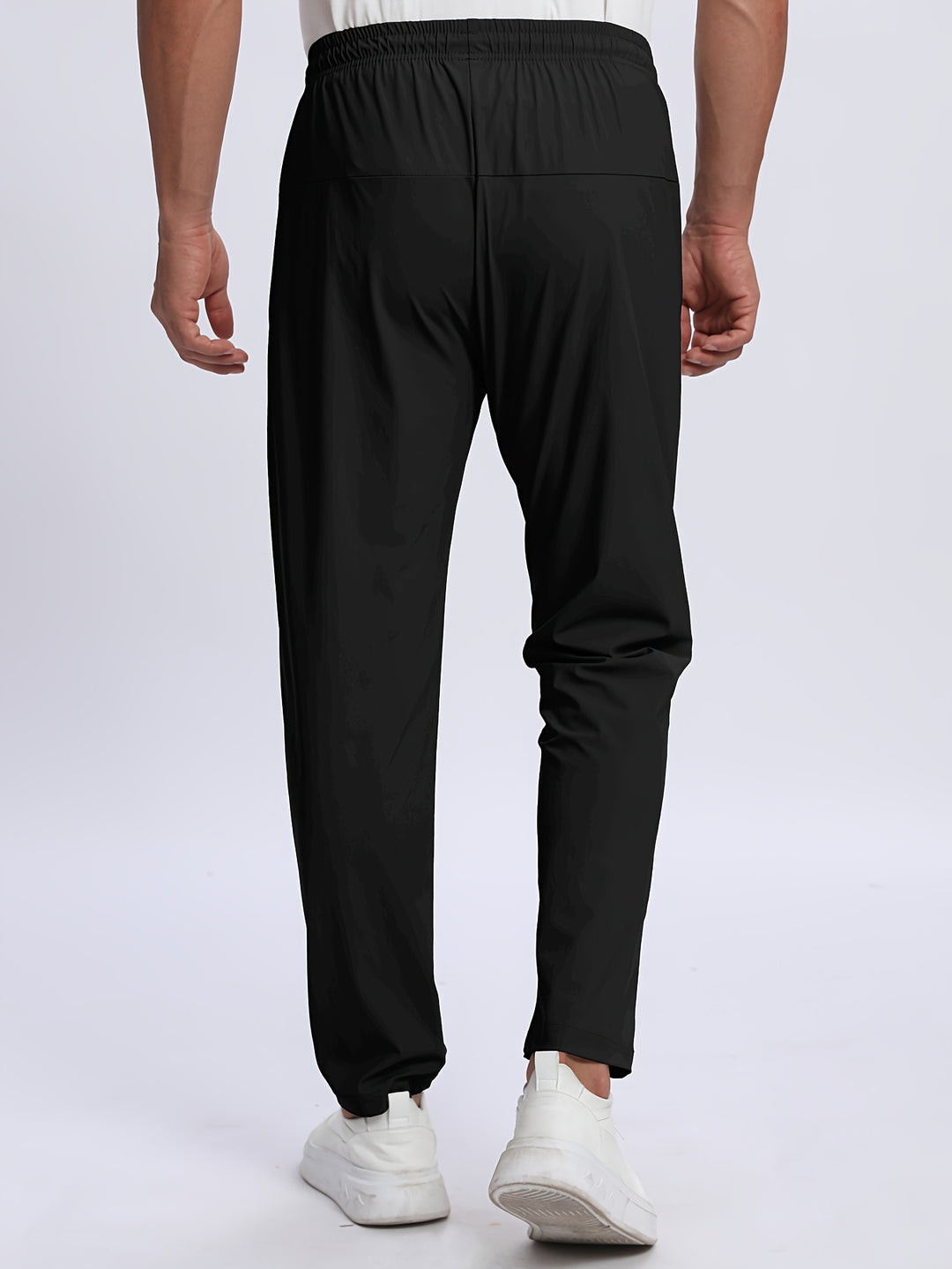Pantaloni sportivi uomo con zip, stile moderno per abbigliamento athleisure e comfort urbano.
