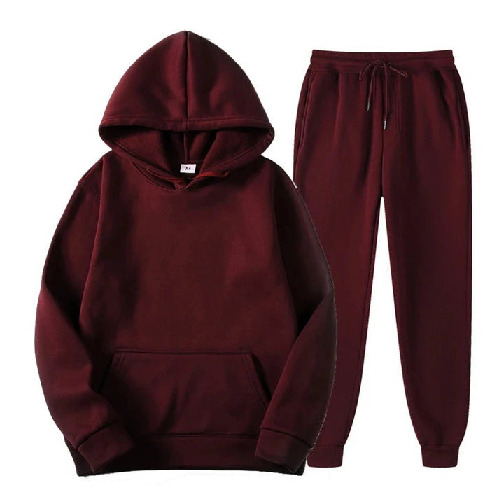 Tuta uomo sportiva e casual con felpa con cappuccio e pantaloni abbinati, perfetta per il tempo libero.