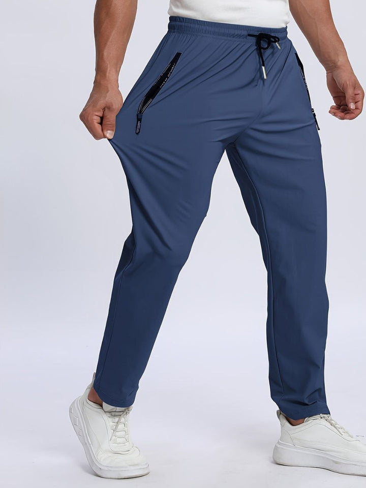 Joggers sportivi uomo neri, elasticizzati per fitness, palestra e avventure outdoor.