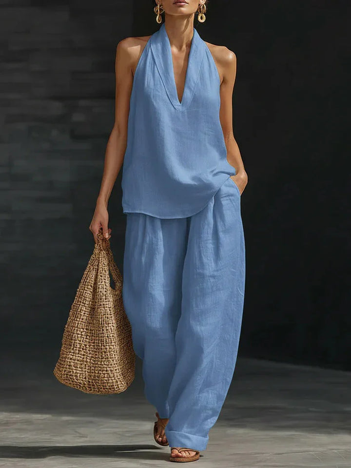 Set coordinato donna comodo per l'estate, con top scollo a V e pantaloni larghi a vita alta, stile versatile.