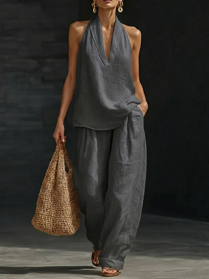 Moda estiva: set coordinato donna con top scollo a V e pantaloni a gamba larga, outfit elegante e moderno.