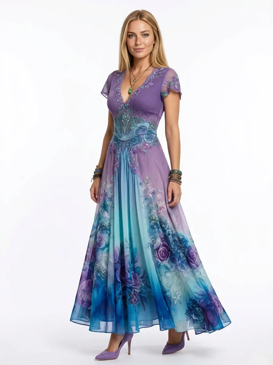 Elegante vestito da donna maxi con stampa floreale e dettagli ricamati. Scollo a V, perfetto per eventi formali estivi.