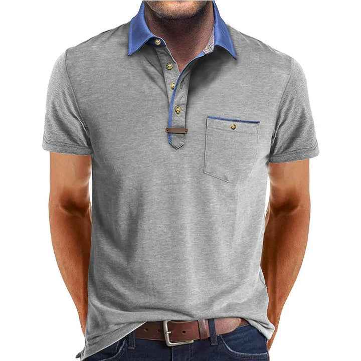 Polo donna, abbigliamento smart casual con colletto contrasto e bottoni dorati, simbolo di eleganza.