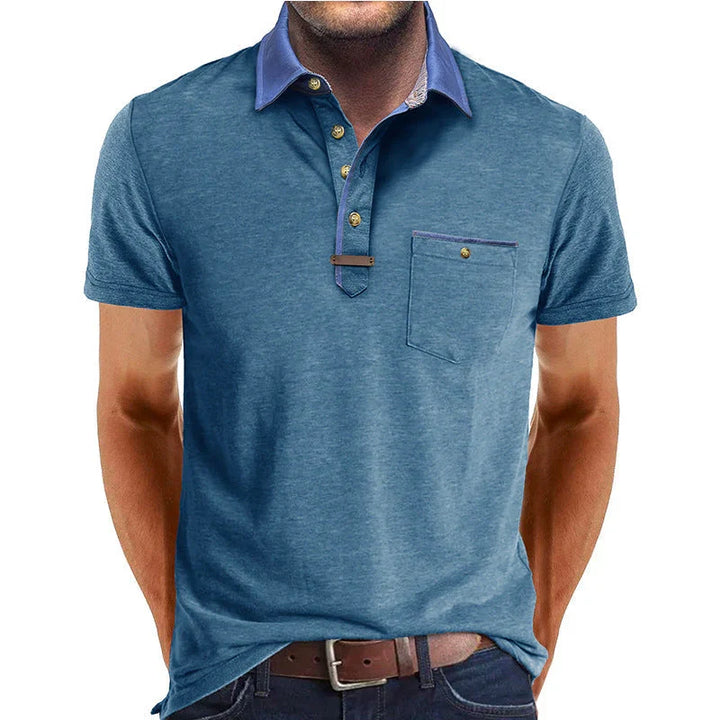 Camicia polo da donna a maniche corte, con taschino e dettagli raffinati per eleganza quotidiana.