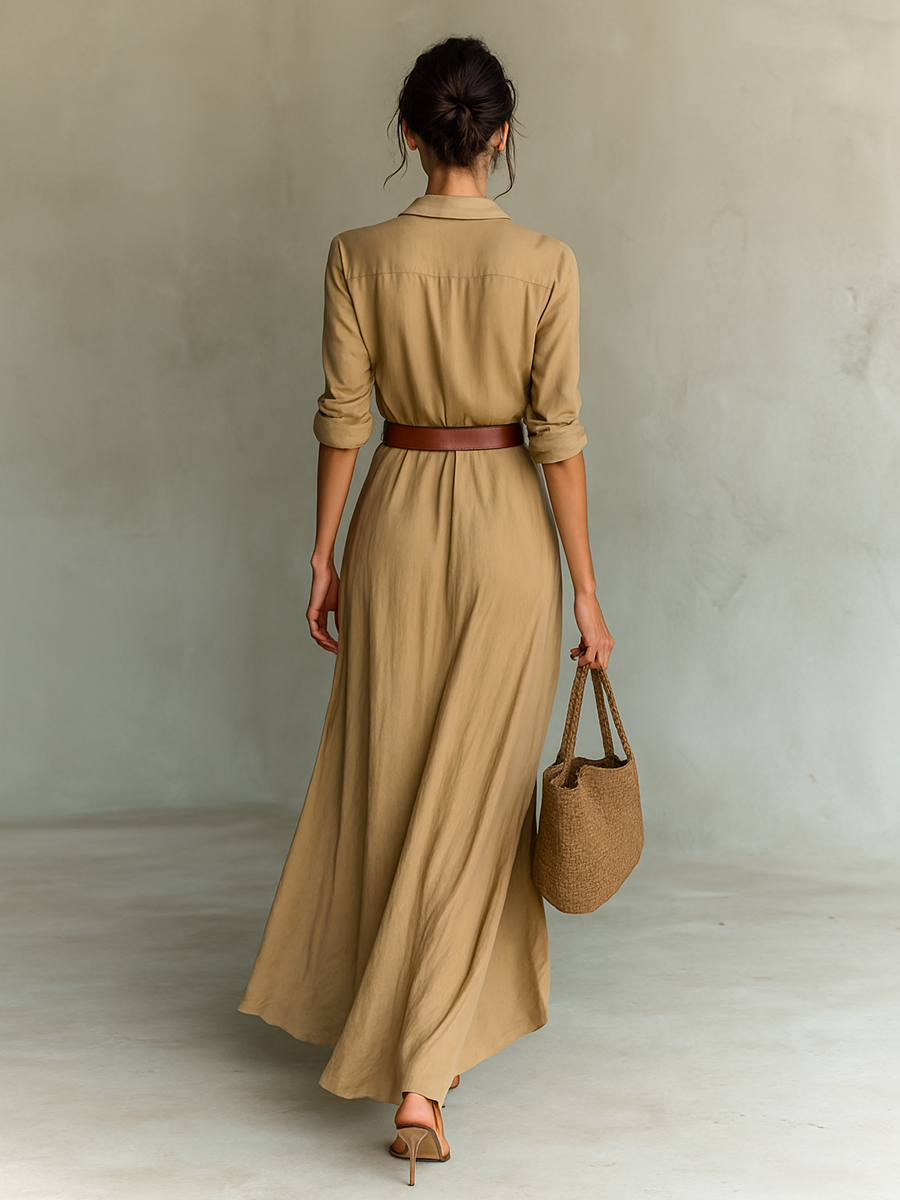 Abito chemisier lungo da donna che valorizza la figura, con bottoni e cintura per una vestibilità elegante.