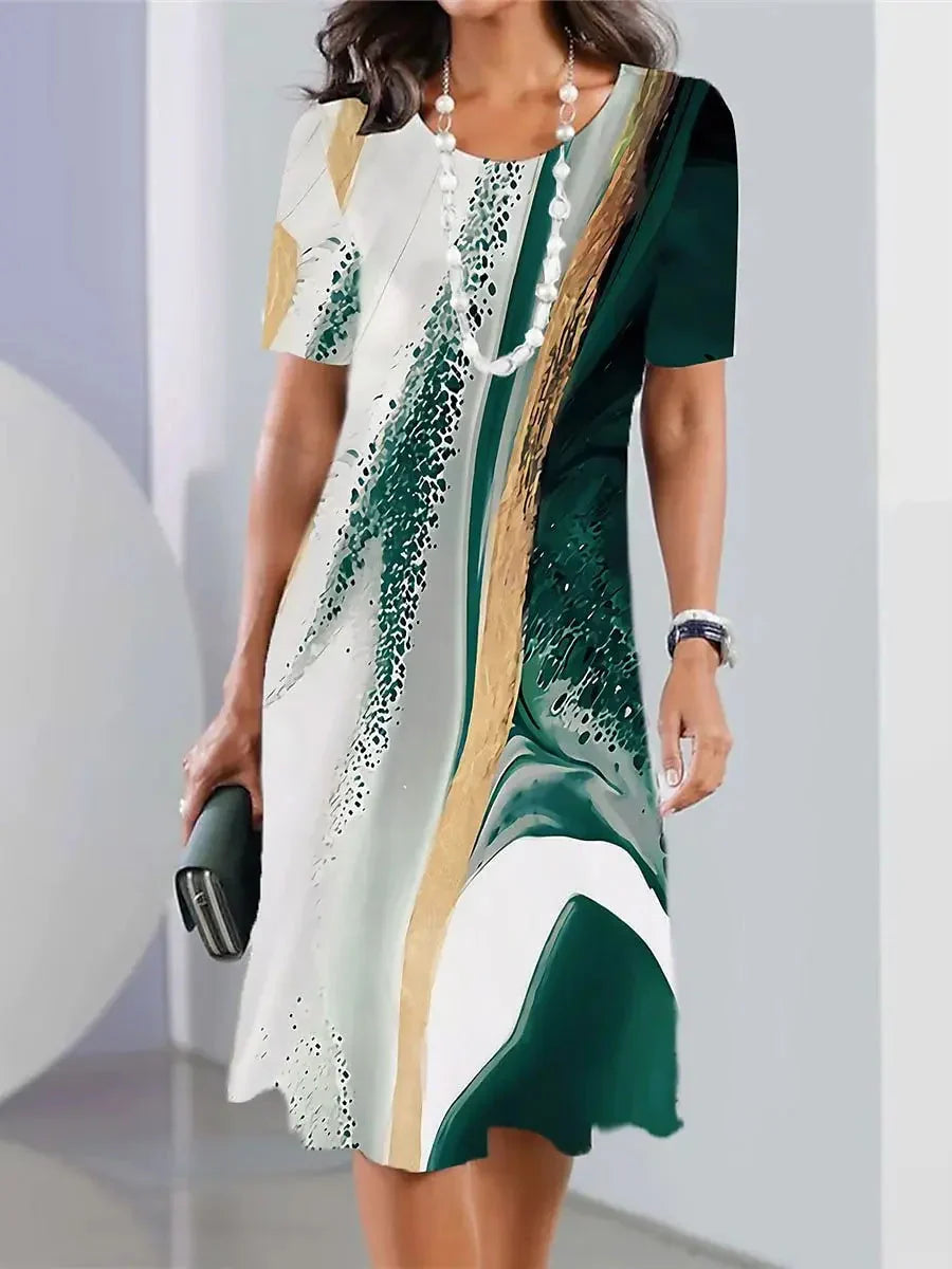 Abito midi donna con stampa astratta, girocollo e taglio ad A. Perfetto per eleganza casual e comfort.