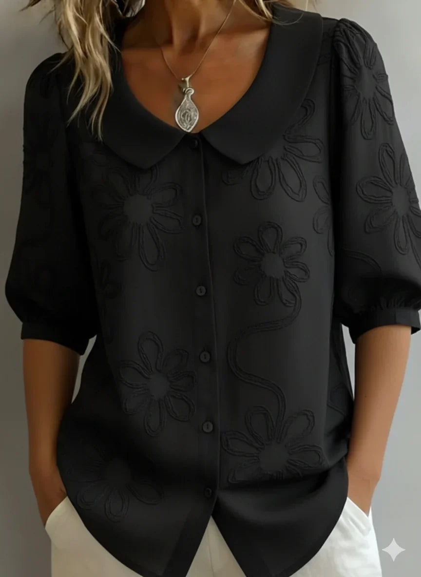 Camicetta donna ricamata floreale, vestibilità rilassata. Eleganza casual per primavera ed estate.