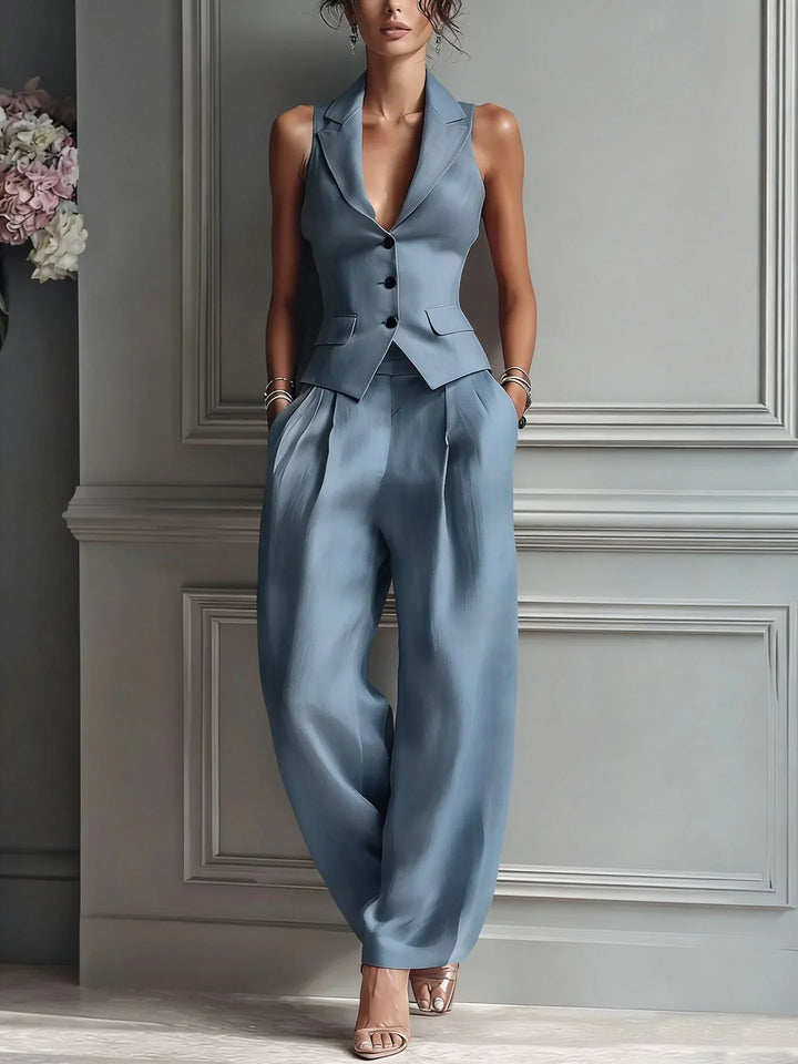 Completo donna due pezzi: gilet e pantaloni palazzo a vita alta. Disponibile in rosa, blu e grigio per ufficio.