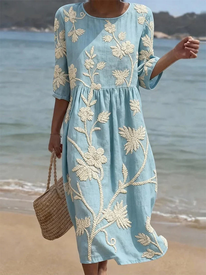 Vestito midi donna ricamato floreale, maniche tre quarti. Abito elegante estivo per look sofisticato.