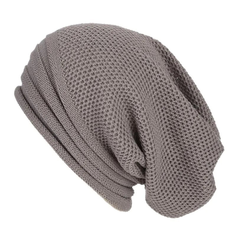 Beanie slouchy ragazza in diversi colori (rosso, beige, bianco), con elegante trama a nido d'ape per l'inverno.