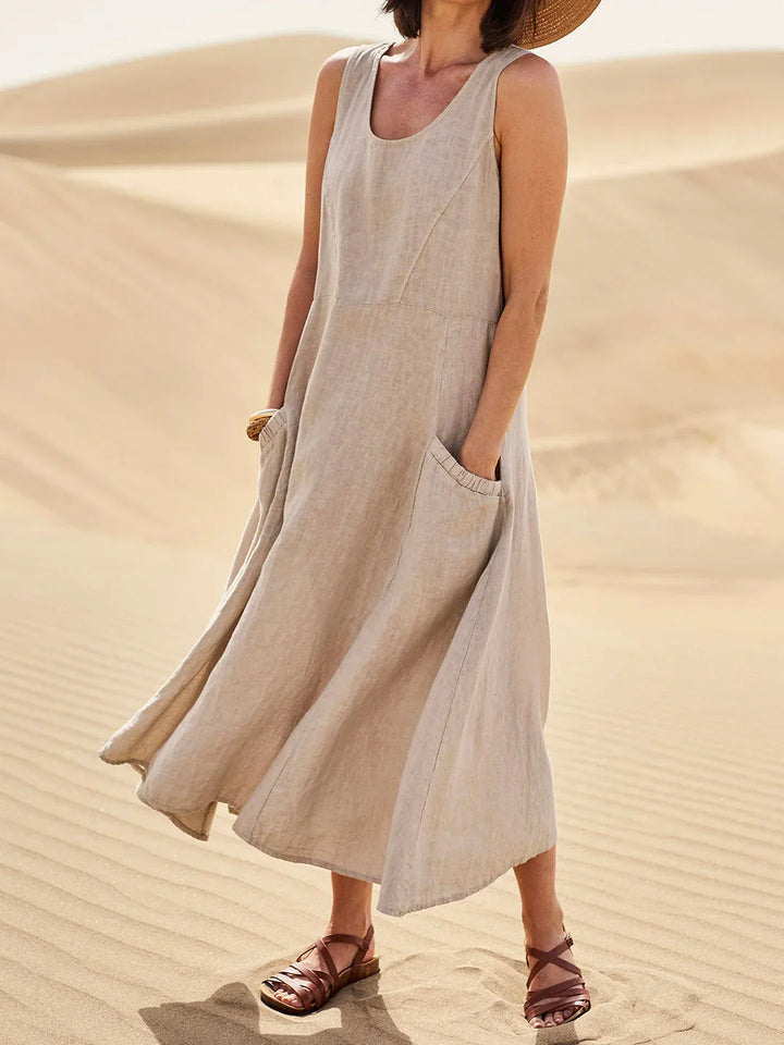 Vestito lungo donna elegante con scollo rotondo e pratiche tasche.