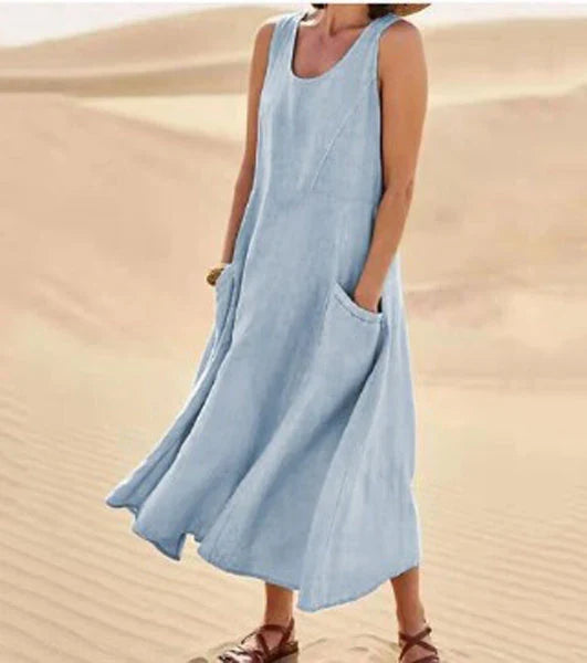 Vestito estivo elegante donna, scollo rotondo e tasche funzionali, moda versatile.