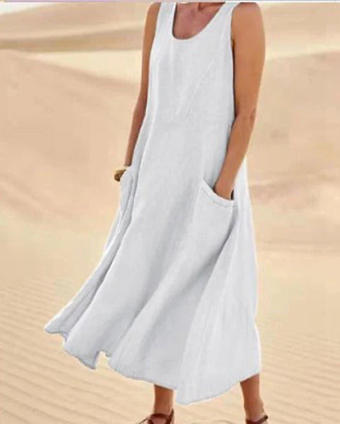 Vestito donna midi con tasche laterali e scollo rotondo, perfetto per la moda estiva.