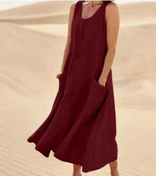 Vestito estivo donna casual con scollo rotondo e comode tasche, stile rilassato.