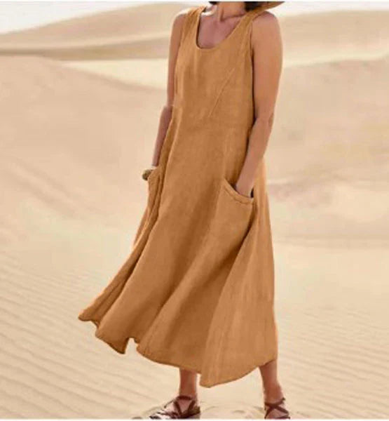 Abito lungo donna scollo rotondo e tasche, perfetto per serate eleganti e occasioni speciali.