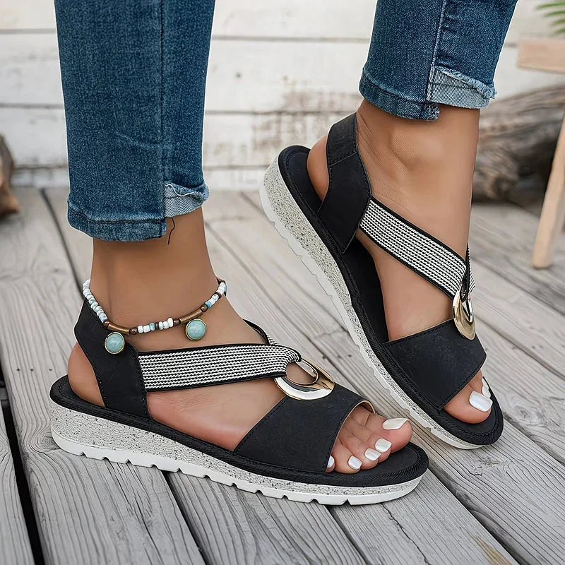 Sandali donna ortopedici con supporto plantare e cinturino intrecciato per un comfort superiore.