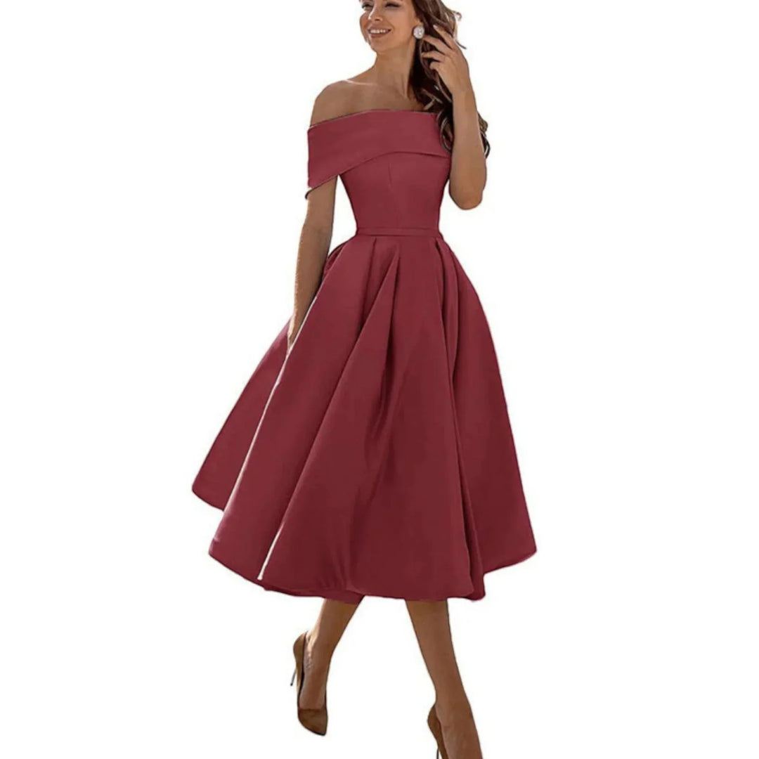 Abito midi da cerimonia off-shoulder, ideale per un look sofisticato e femminile.
