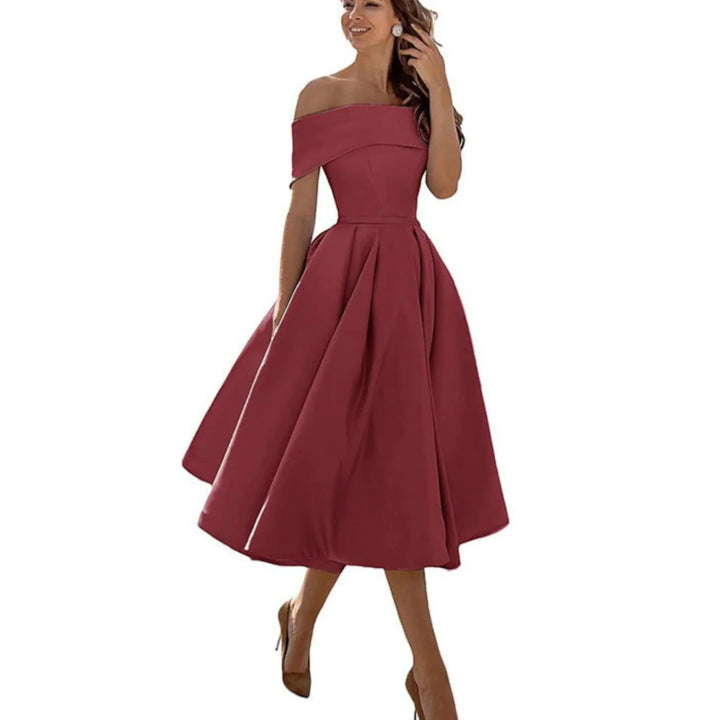 Abito midi da cerimonia off-shoulder, ideale per un look sofisticato e femminile.