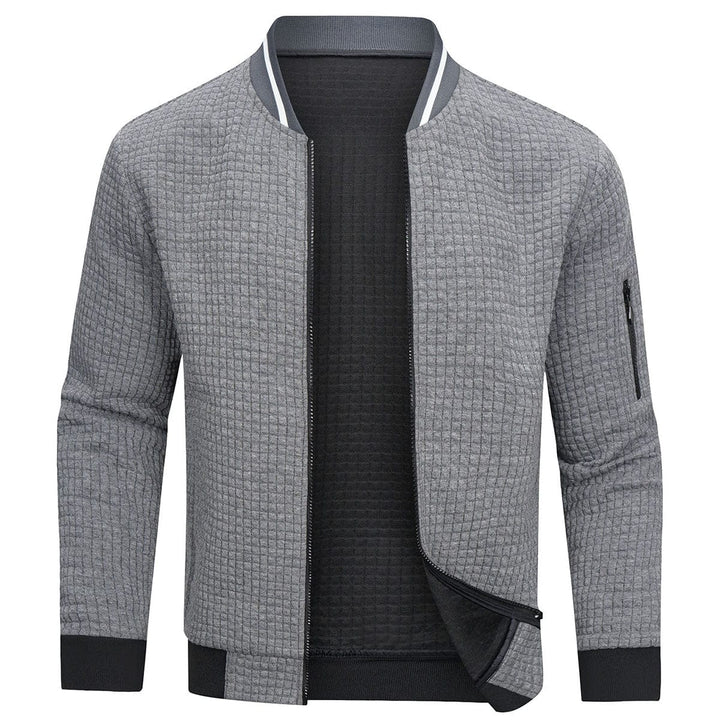 Cardigan uomo con zip, design moderno ed elegante. Ideale per look versatili, casual o formali.