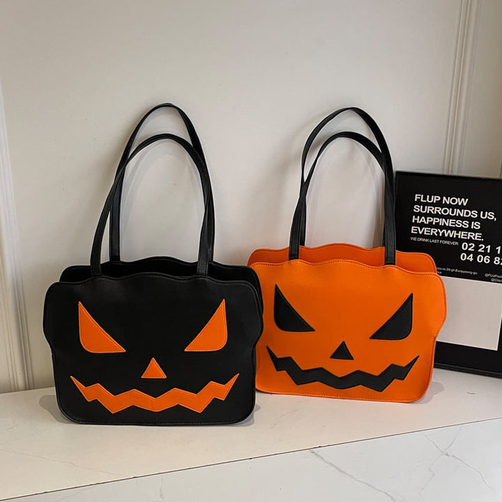 Borsa a tracolla donna Halloween con zucca Jack-O'-Lantern arancione su sfondo nero, accessorio festivo.