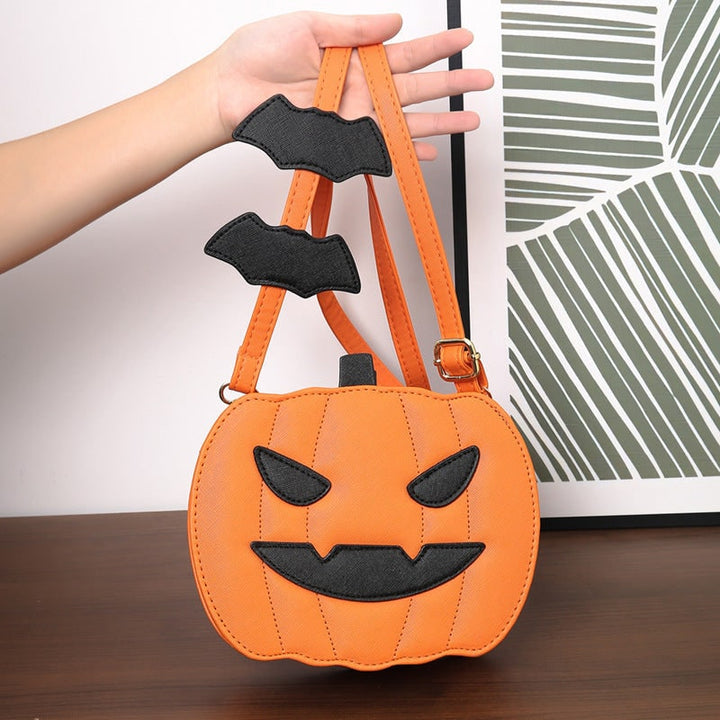 Accessorio moda Halloween: borsa a tracolla con zucca intagliata e dettagli di pipistrelli per donna.