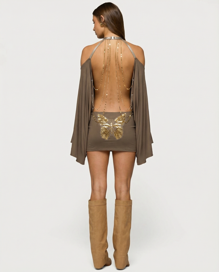Mini abito donna elegante schiena scoperta, catene oro. Ideale per feste, serate e occasioni speciali, moda chic.