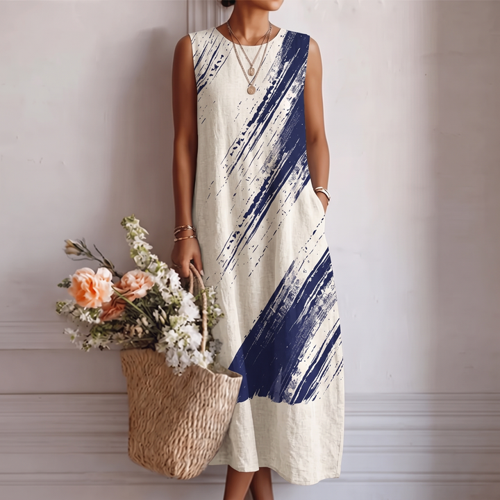 Abito midi da donna elegante blu con stampa astratta, senza maniche, perfetto per eventi estivi o look da giorno.
