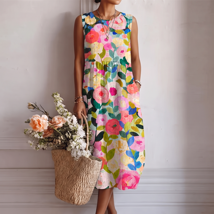 Abito midi donna floreale senza maniche, elegante e vivace, perfetto per l'estate e le vacanze.