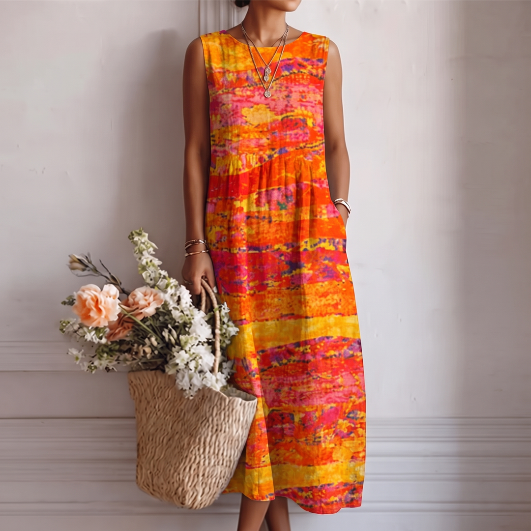 Abito midi smanicato donna con stampa astratta solare, perfetto per look estivi casual o eleganti.