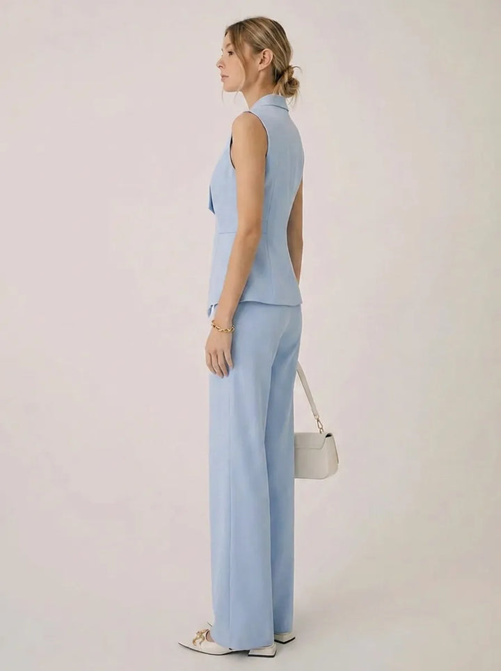 Completo due pezzi donna nero: top halter senza maniche e pantaloni ampi. Ideale per un outfit casual chic estivo.