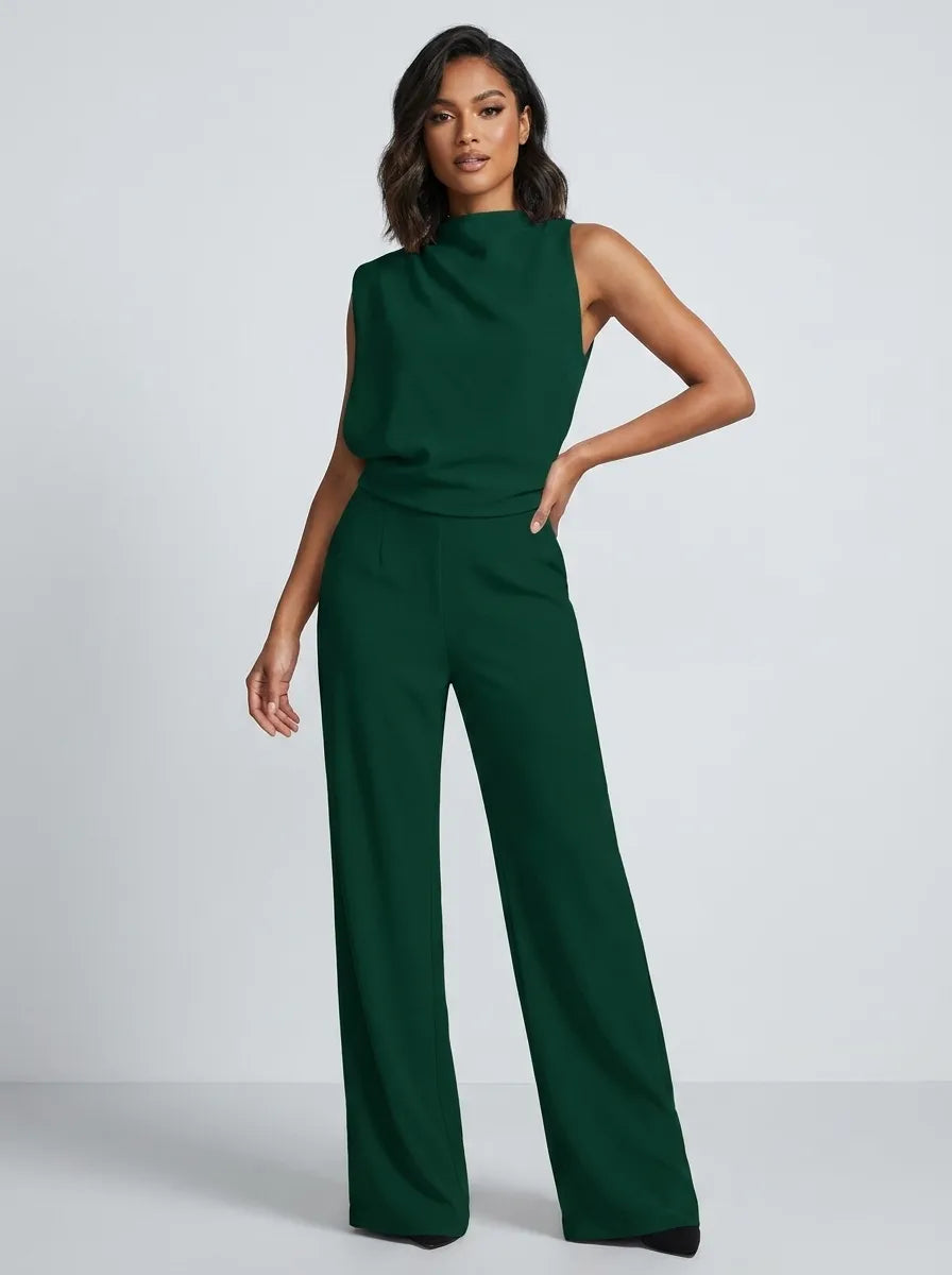 Tuta lunga donna elegante nera, senza maniche, collo alto e gamba larga. Perfetta per un look chic da sera.
