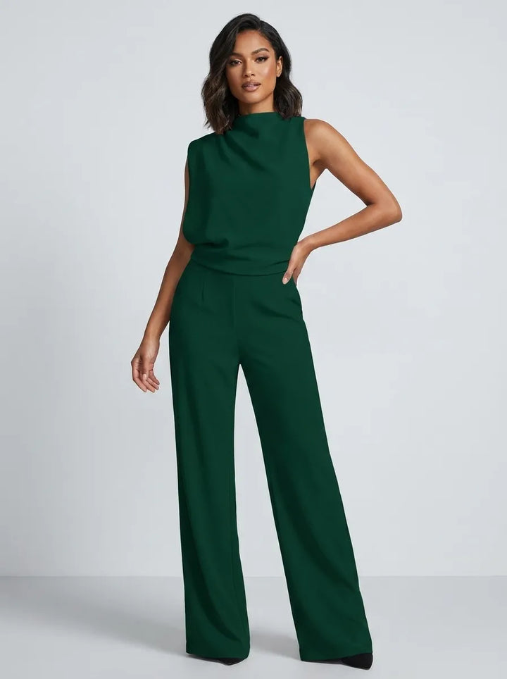 Tuta lunga donna elegante nera, senza maniche, collo alto e gamba larga. Perfetta per un look chic da sera.