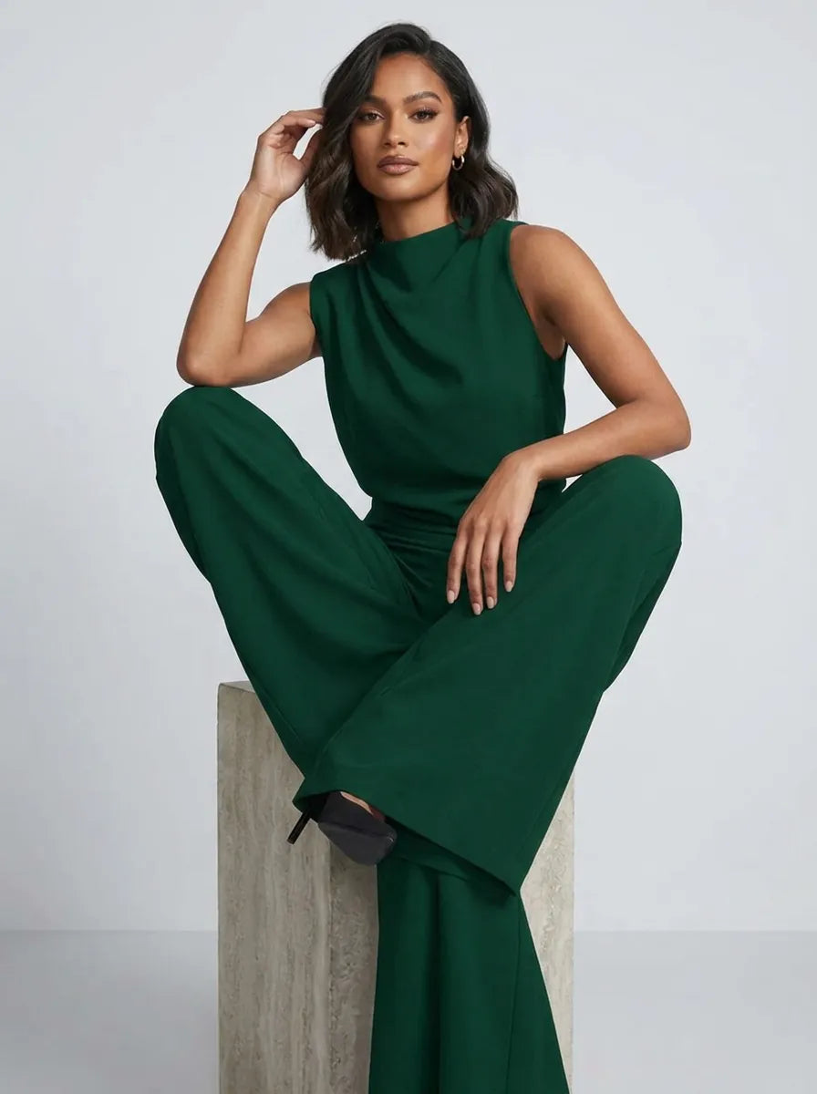 Tuta lunga donna versatile, perfetta per outfit eleganti o casual chic. Senza maniche, collo alto, gamba larga.
