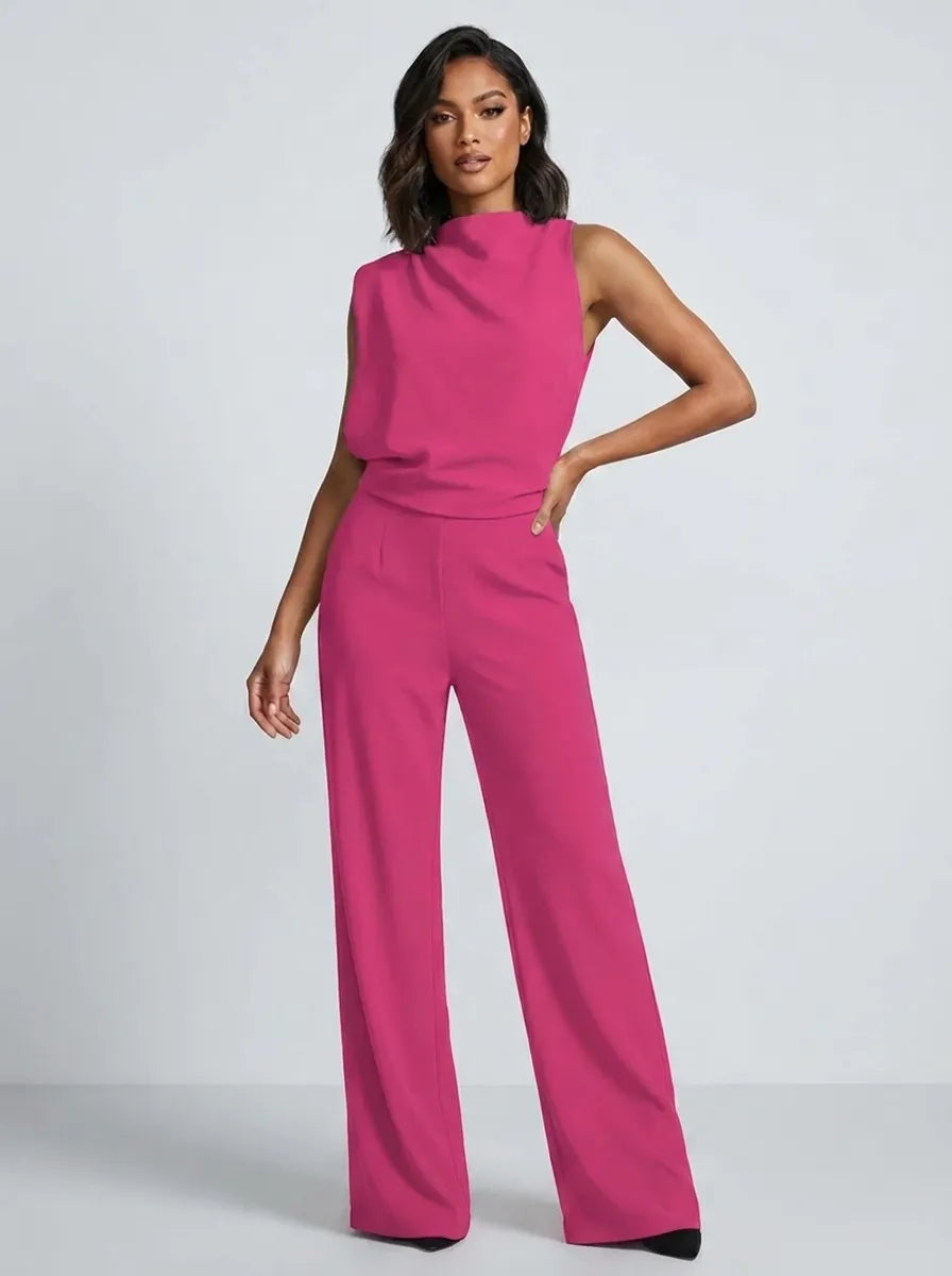Tuta lunga donna alla moda, collo alto, senza maniche e gamba larga. Perfetta per esprimere la tua personalità chic.