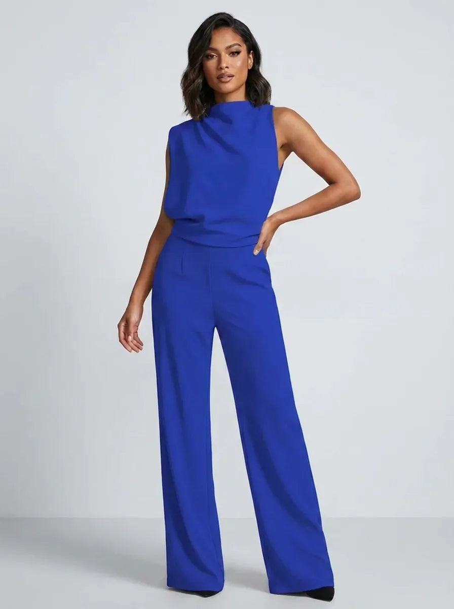 Tuta lunga donna, design senza maniche e collo alto, con gamba larga. Versatile per eventi eleganti o casual.