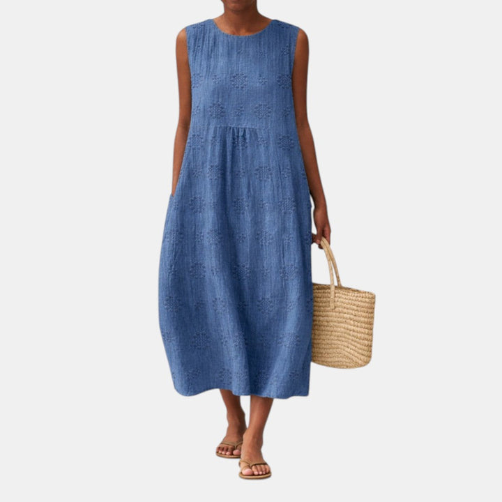 Abito midi senza maniche da donna, con delicato ricamo traforato floreale, perfetto per un look casual-chic.