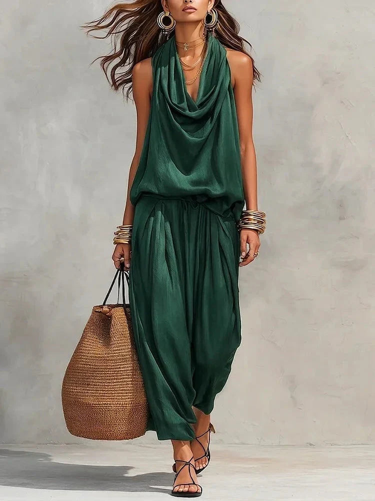 Outfit donna completo estivo, top drappeggiato e pantaloni ampi, ideale per look serale o casual elegante.
