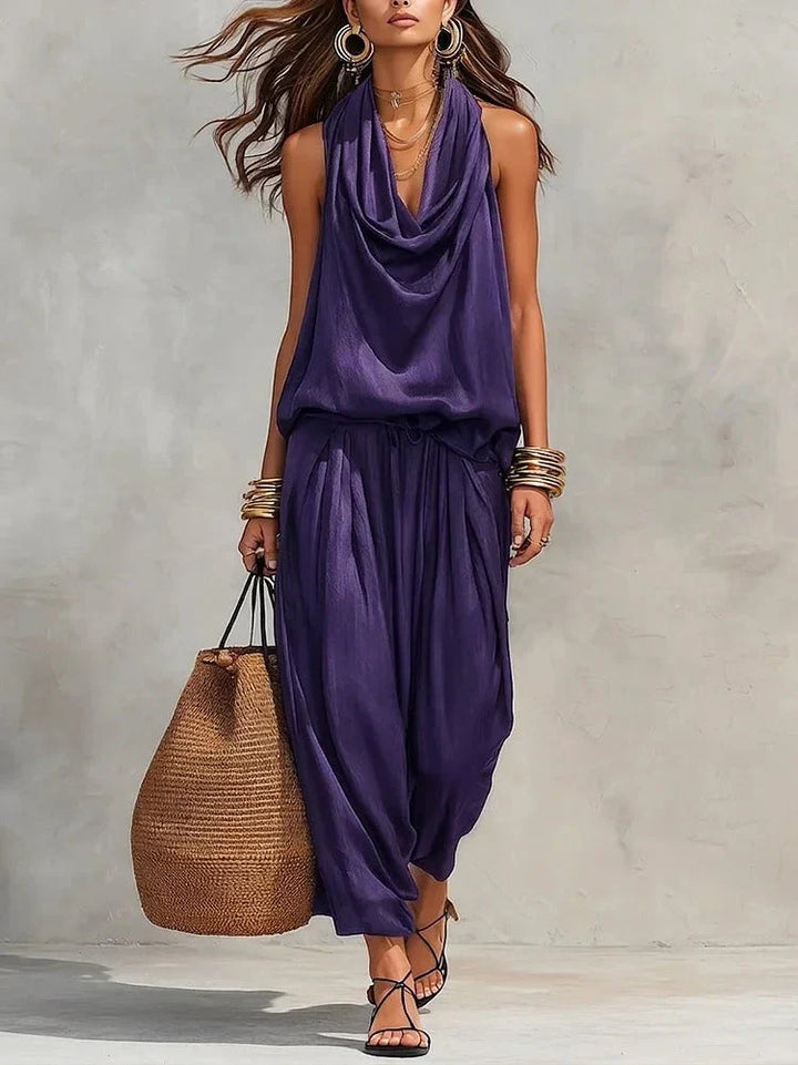 Completo donna versatile con top drappeggiato e pantaloni palazzo per comfort chic e stile senza tempo.