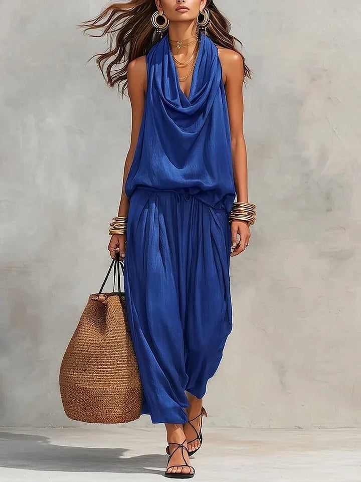 Set coordinato donna: top drappeggiato senza maniche e pantaloni a gamba larga, per outfit estivo elegante.