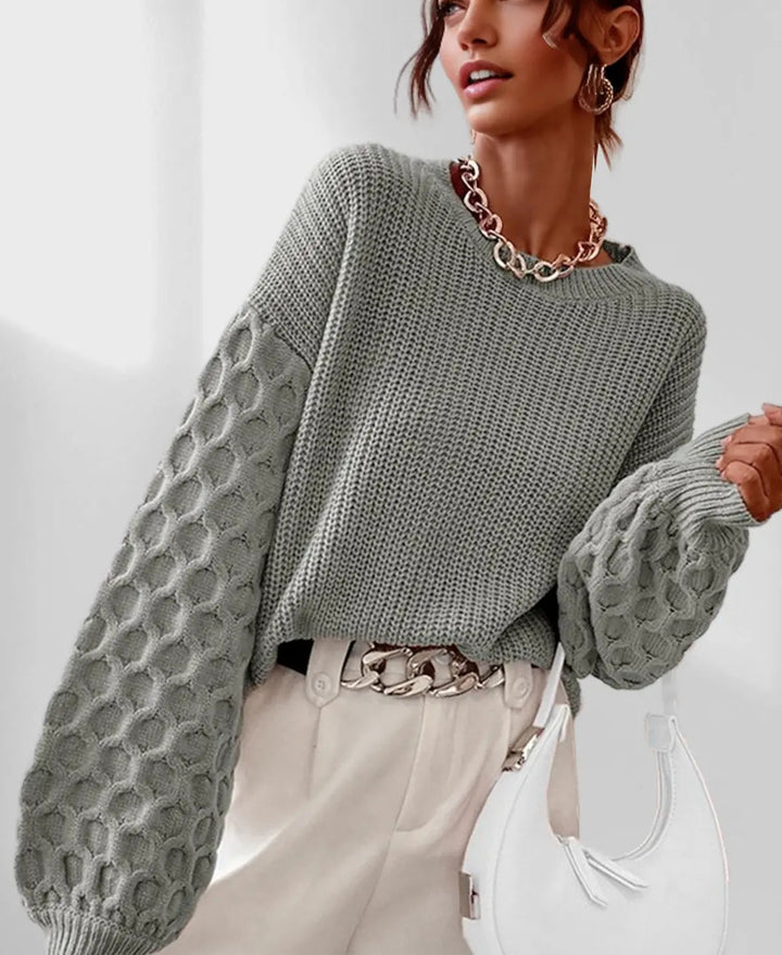 Maglione donna in maglieria calda e avvolgente, perfetto per l'inverno, con maniche a palloncino eleganti.