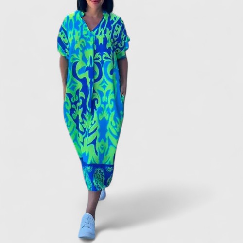 Vestito lungo floreale da donna con stampa vivace, versatile per look casual o eleganti. Ideale per l'estate.