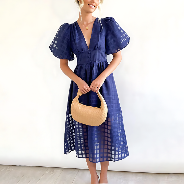 Vestito midi estivo da donna, elegante e traspirante. Perfetto per un look chic e confortevole in vacanza.