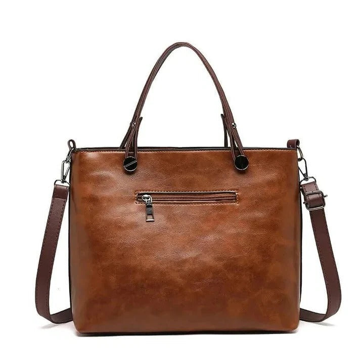 Borsa a tracolla strutturata da donna, perfetta per un look elegante o quotidiano, disponibile in colori versatili.