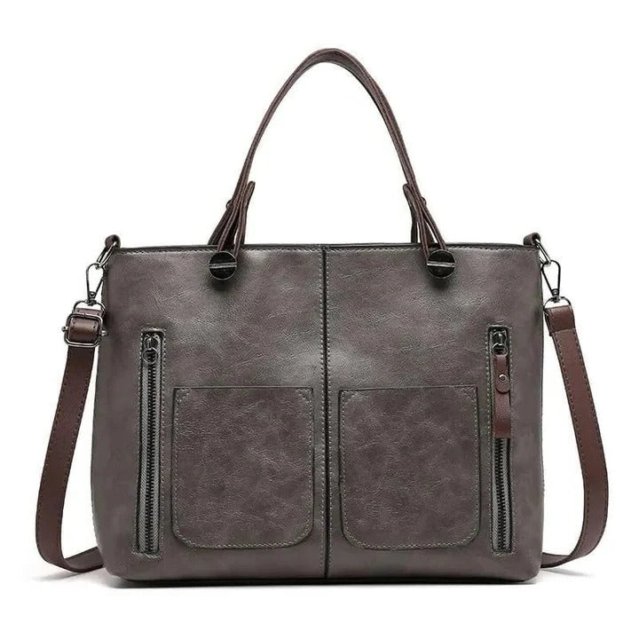 Elegante borsa a tracolla strutturata grigia per donna, ideale per uno stile quotidiano versatile e organizzato.